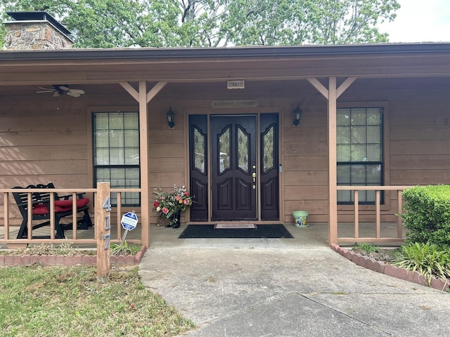 view of exterior entry featuring a porch