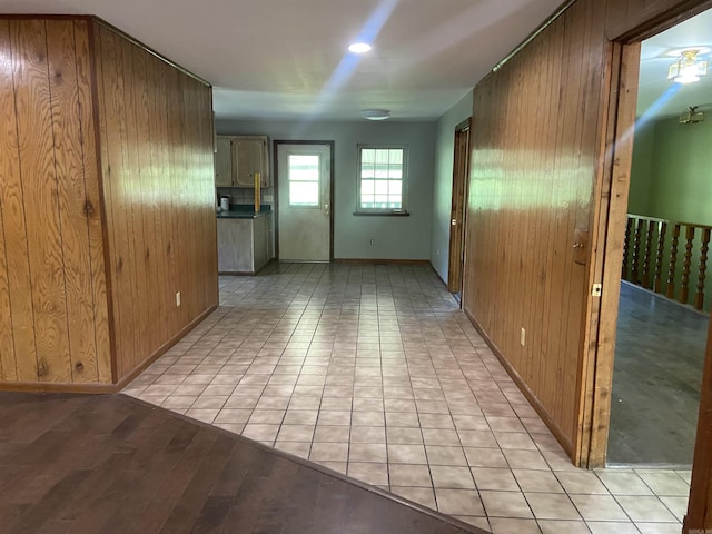empty room featuring wood walls