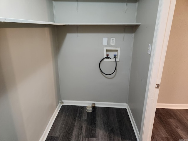 clothes washing area featuring wood finished floors, hookup for a washing machine, and baseboards
