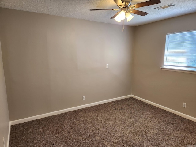 empty room featuring a textured ceiling, ceiling fan, carpet floors, baseboards, and visible vents