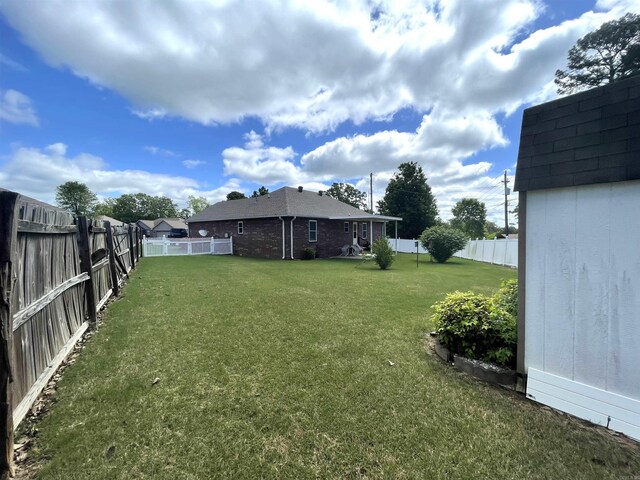 view of yard with a fenced backyard