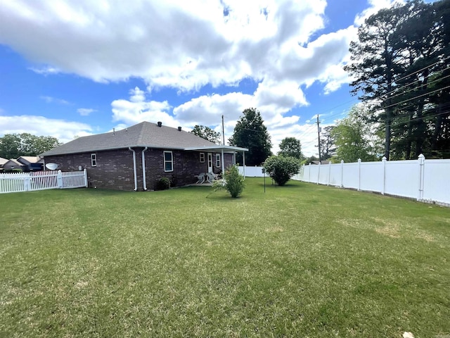 view of yard featuring a fenced backyard