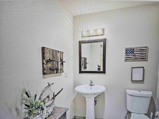 half bathroom with toilet