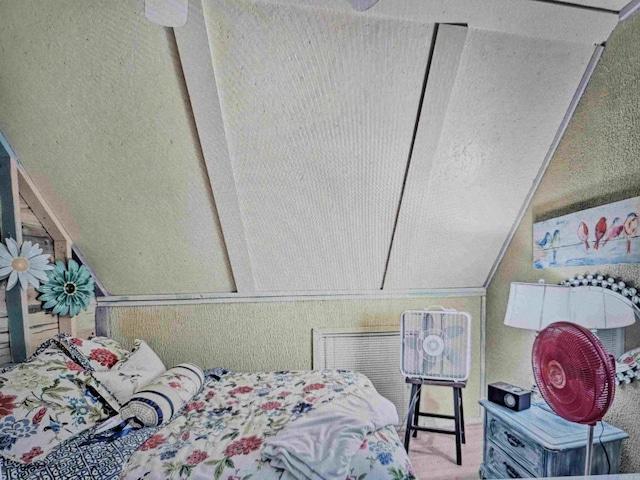 carpeted bedroom featuring vaulted ceiling