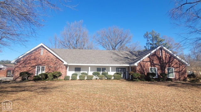 609 Liberty, Marked Tree, AR 72365 - view of front of house with brick siding and a front lawn