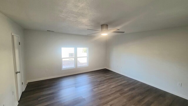 609 Liberty, Marked Tree, AR 72365 - spare room with ceiling fan, baseboards, dark wood-type flooring, and a textured ceiling