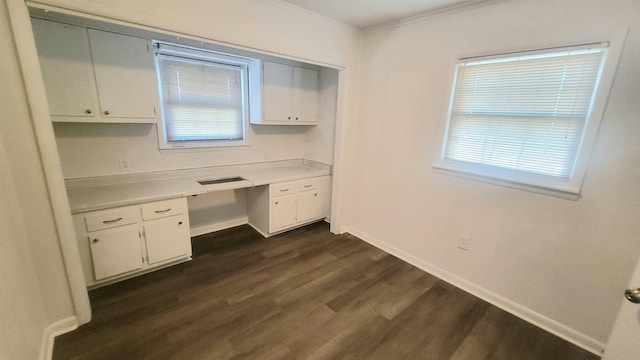 609 Liberty, Marked Tree, AR 72365 - unfurnished office featuring a wealth of natural light, dark wood finished floors, baseboards, built in study area, and crown molding