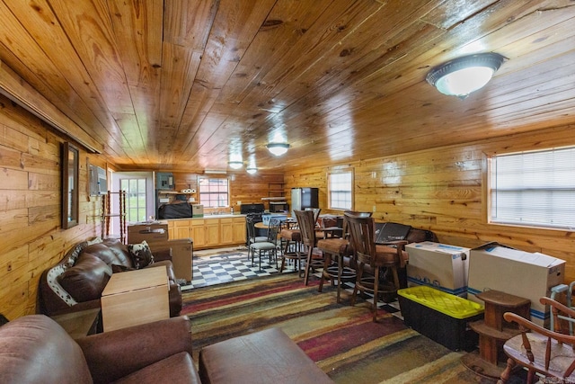 living room with wooden ceiling and wood walls