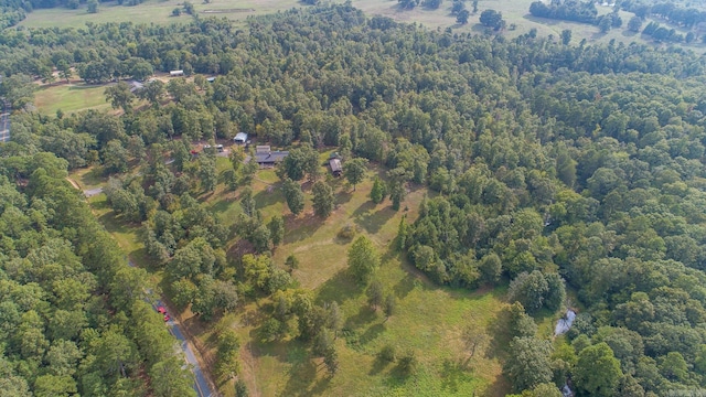 bird's eye view featuring a wooded view