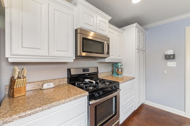 kitchen with stainless steel appliances, baseboards, finished concrete floors, and white cabinetry