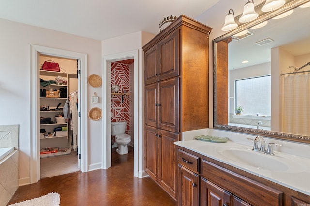 full bath with vanity, visible vents, finished concrete flooring, and toilet