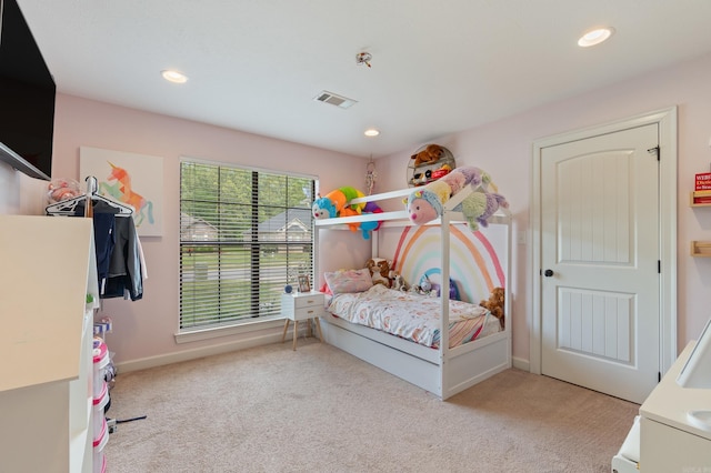 carpeted bedroom featuring baseboards, visible vents, and recessed lighting