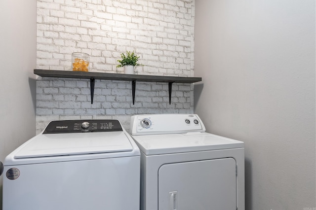 washroom featuring washer and dryer and laundry area