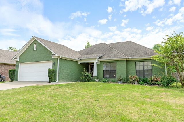 view of front facade with roof with shingles, a front lawn, driveway, a garage, and stucco siding
