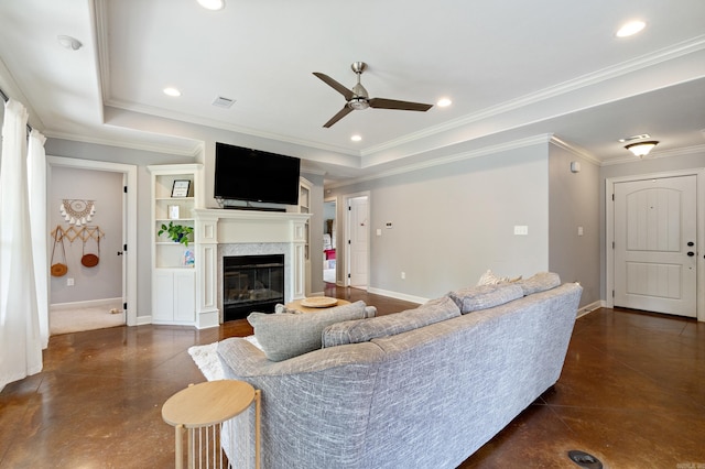 living room featuring concrete flooring, a ceiling fan, a glass covered fireplace, and baseboards