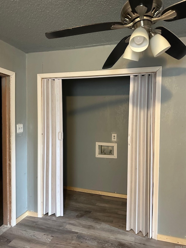 interior details with baseboards, a ceiling fan, and wood finished floors