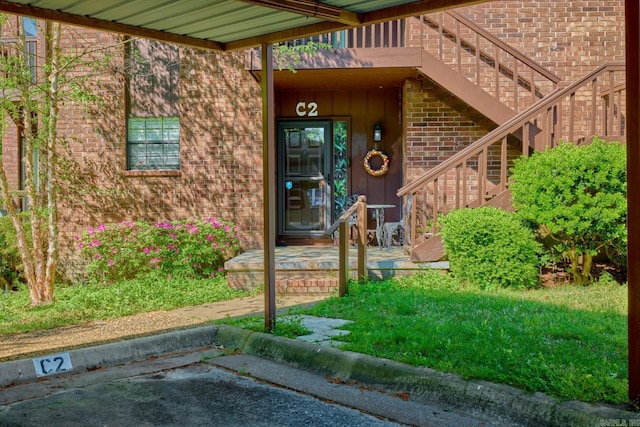 property entrance with brick siding