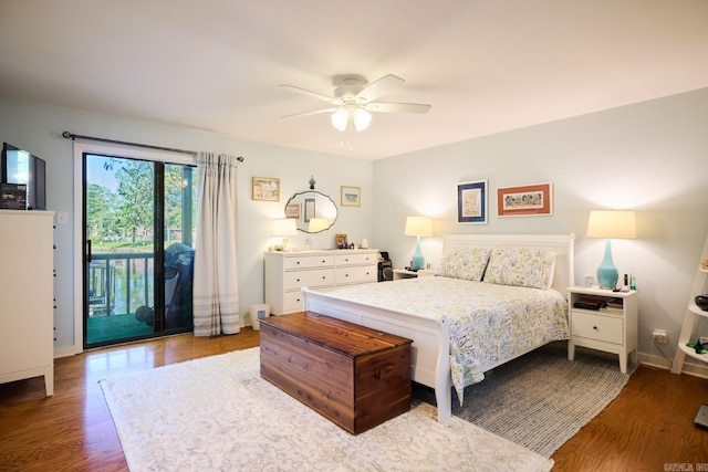bedroom featuring a ceiling fan, baseboards, access to outside, and wood finished floors