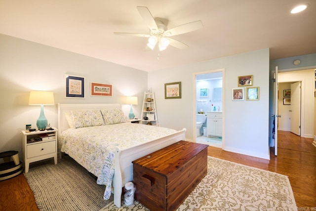bedroom featuring a ceiling fan, wood finished floors, and ensuite bathroom
