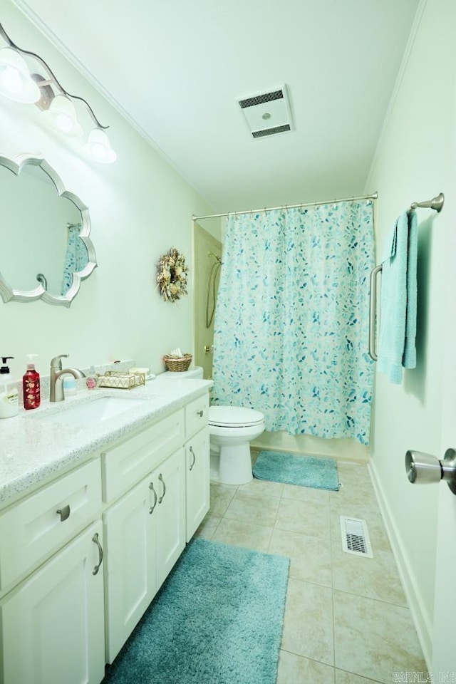 bathroom with visible vents, tile patterned flooring, vanity, and toilet