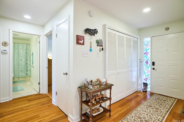entryway featuring light wood-style flooring and recessed lighting