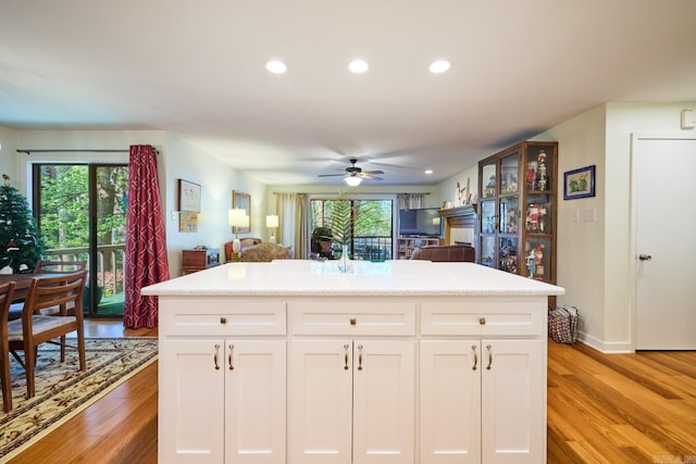 kitchen featuring recessed lighting, a wealth of natural light, a ceiling fan, and light wood-style flooring