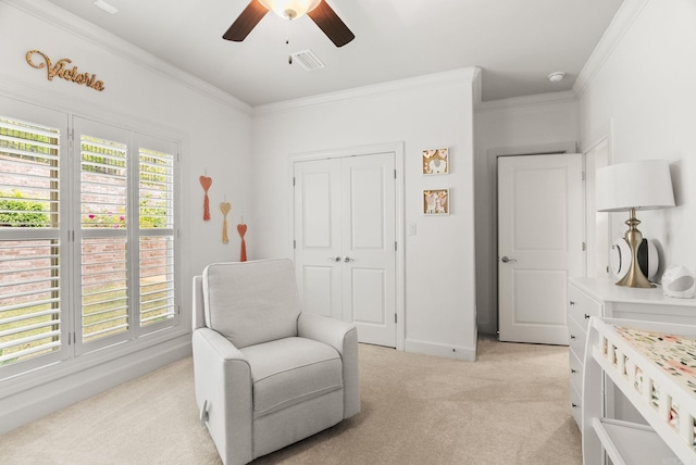 bedroom with visible vents, ornamental molding, baseboards, light colored carpet, and ceiling fan