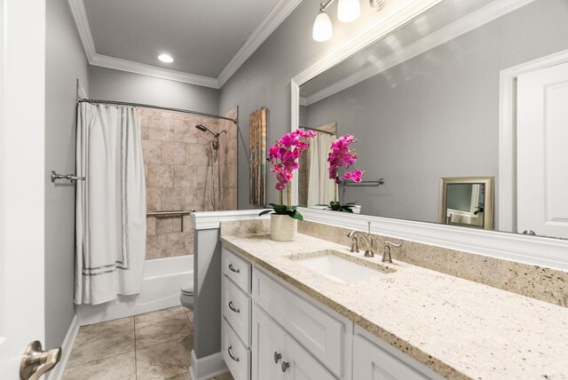 full bath featuring tile patterned flooring, toilet, vanity, ornamental molding, and shower / bath combo with shower curtain