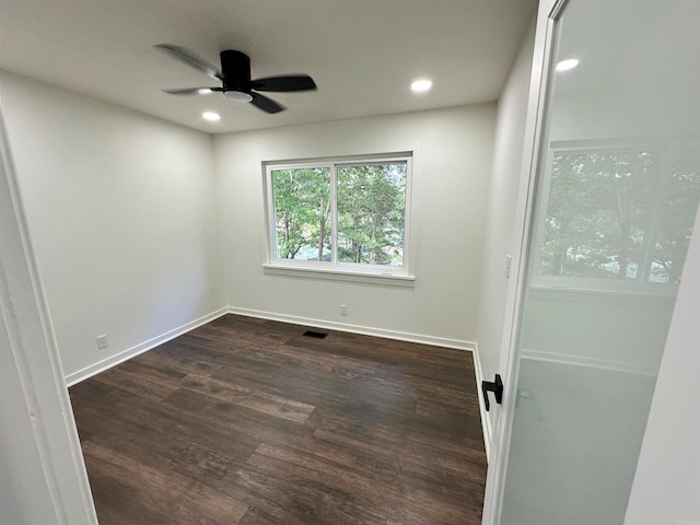 unfurnished room with recessed lighting, dark wood finished floors, visible vents, and a ceiling fan