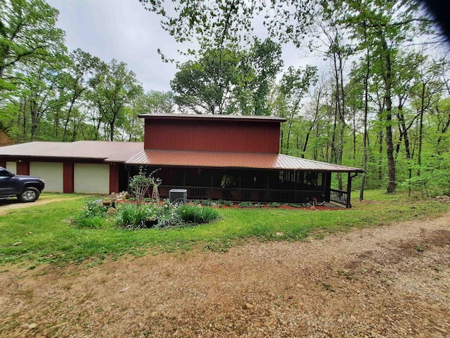 3986 Oak Grove Loop, Mountain View, AR 72560 - view of home's exterior with an attached garage and metal roof