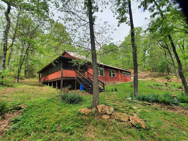 3986 Oak Grove Loop, Mountain View, AR 72560 - rear view of property featuring stairway, a deck, and a wooded view