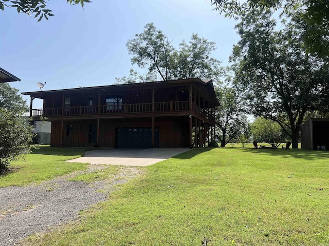 3223 Canal Dr, White Hall, AR 71602 - view of front of property with a garage, driveway, a front lawn, and a deck