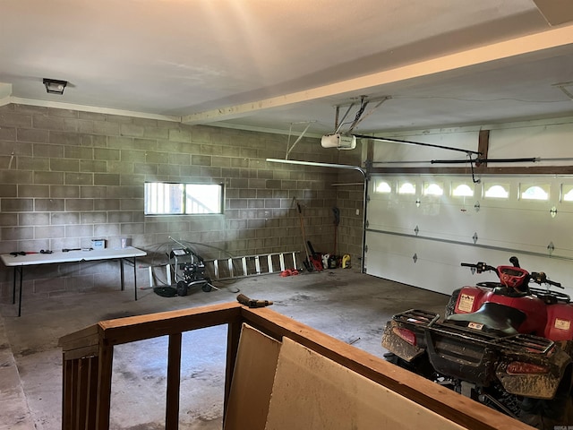 3223 Canal Dr, White Hall, AR 71602 - garage with a garage door opener and concrete block wall