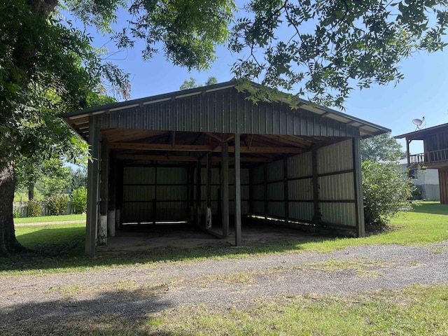 3223 Canal Dr, White Hall, AR 71602 - view of parking / parking lot with a detached carport and a pole building