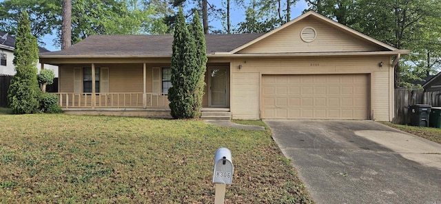 single story home with a garage, driveway, a front yard, and covered porch