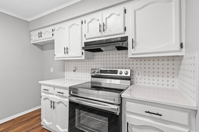 kitchen featuring stainless steel range with electric cooktop, dark wood-style floors, under cabinet range hood, crown molding, and white cabinetry