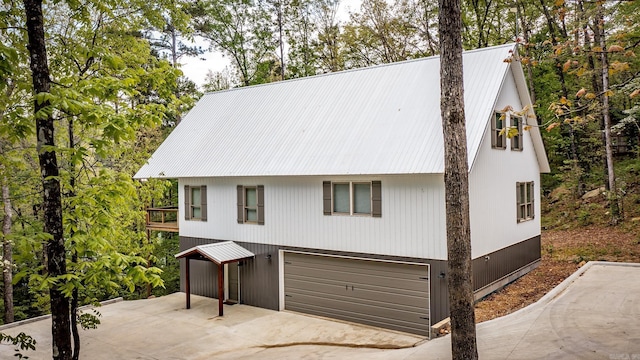 93 Pocahontas Ln, Greers Ferry, AR 72067 - view of front of property featuring concrete driveway and metal roof