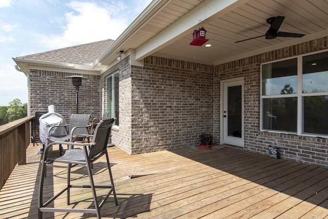 wooden terrace featuring ceiling fan