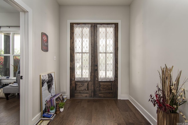 entryway featuring a wealth of natural light, baseboards, dark wood-style flooring, and french doors