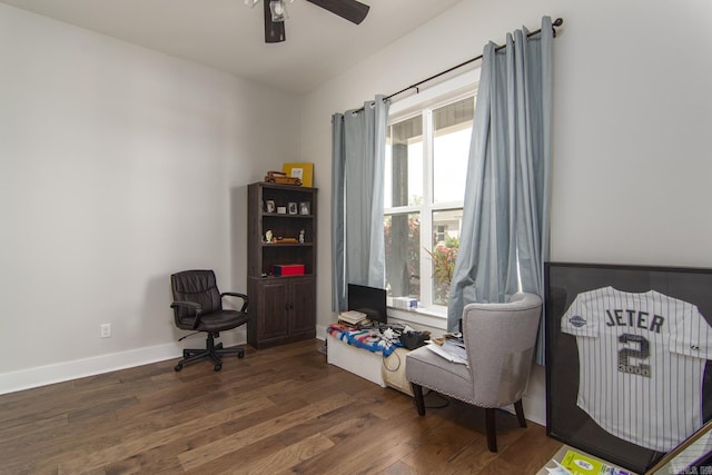 sitting room featuring wood finished floors, a ceiling fan, and baseboards
