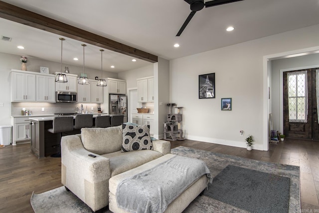 living room with baseboards, visible vents, recessed lighting, and dark wood-type flooring