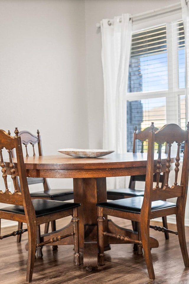 dining room with wood finished floors