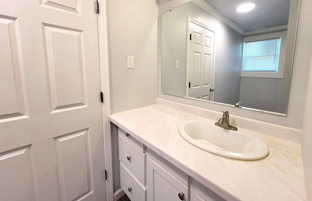 bathroom featuring vanity and ornamental molding