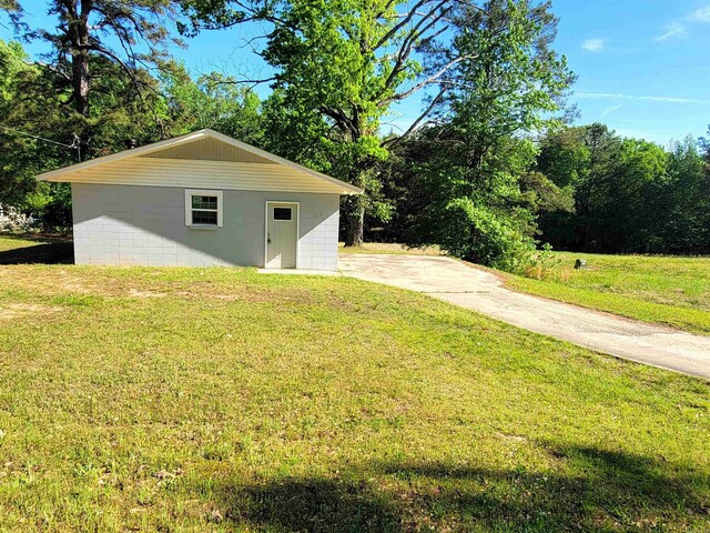 exterior space featuring concrete driveway
