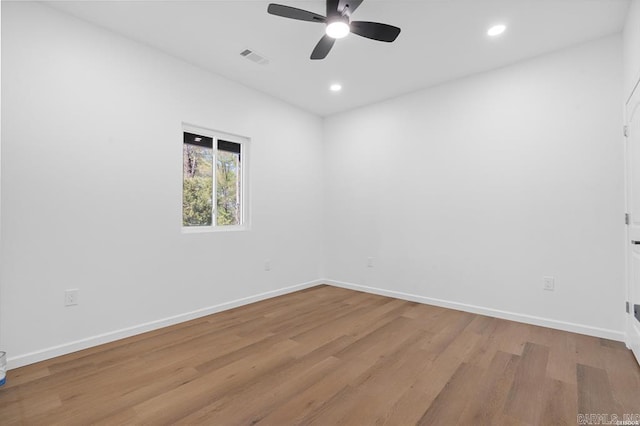 unfurnished room featuring baseboards, a ceiling fan, wood finished floors, and recessed lighting