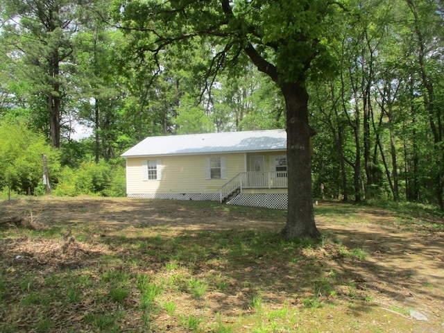 rear view of house with metal roof