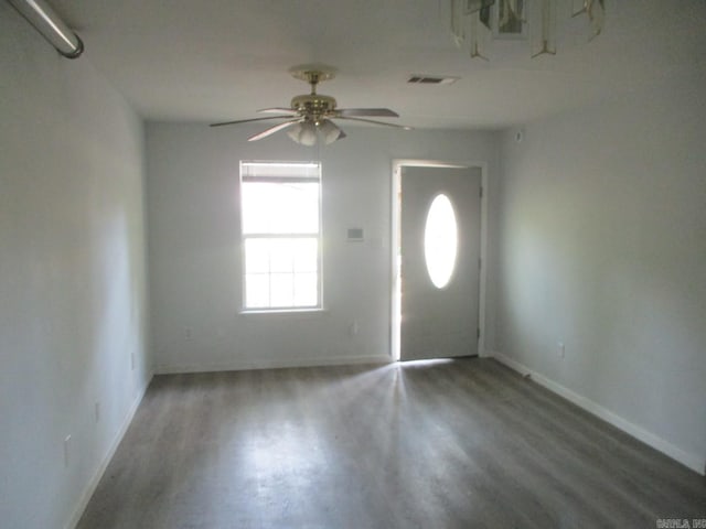 entryway featuring baseboards, a ceiling fan, and visible vents