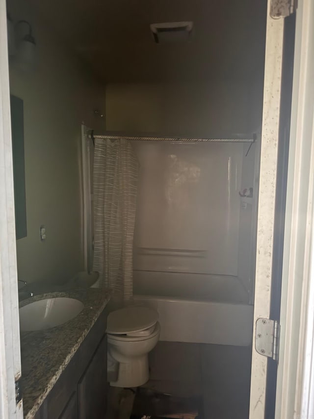 bathroom featuring toilet and vanity