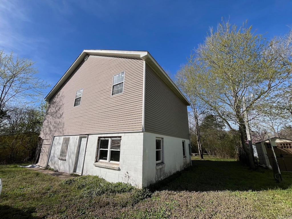 view of home's exterior with a yard