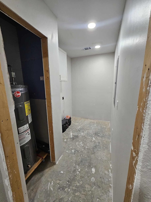 interior space featuring electric water heater and visible vents